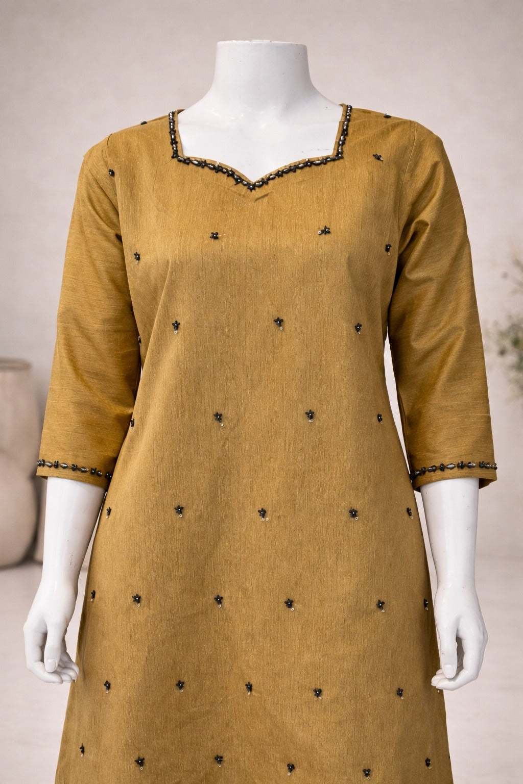 Mustard raw silk sleeve detail with embellished cuff finishing