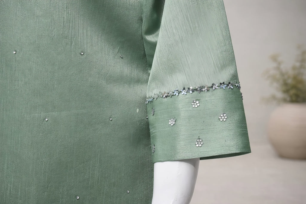 Three quarter sleeve detail with subtle embellishment on mint green silk farshi shalwar suit