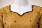 Mustard raw silk neckline close up with black bead and sequin embellishment
