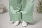 Traditional wide farshi shalwar hem detail with fine embellishment in mint green silk fabric