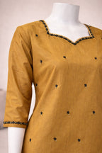 Mustard raw silk embellished suit front view with straight cut silhouette